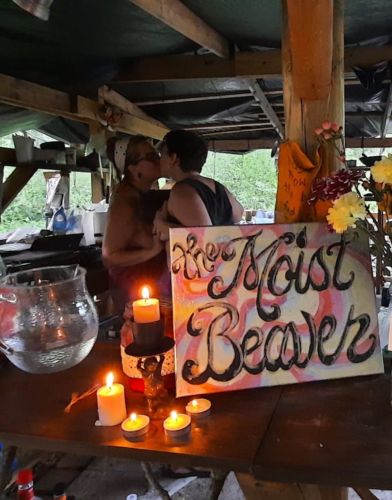 Image of people kissing in the Moist Beaver bar at Half Baked Homestead